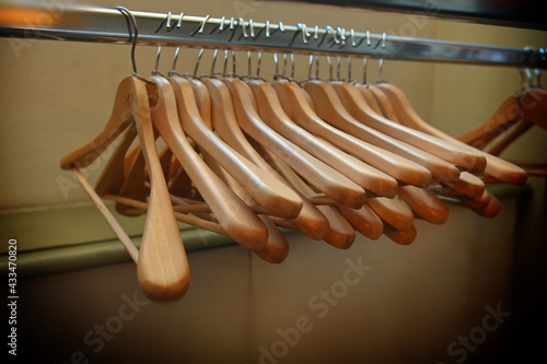 Deserted cloakroom clothes rack in convention center photo