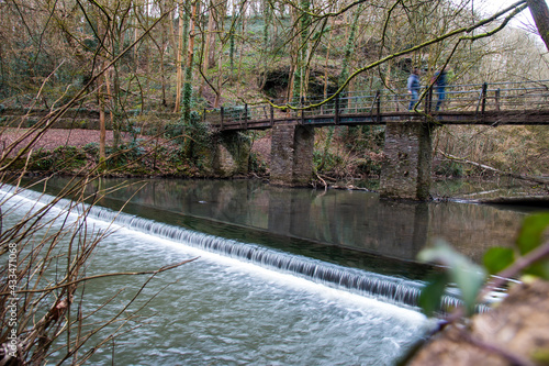 Εκτύπωση καμβά Bridge over a waterfall in Snuff Mills park, Bristol, UK