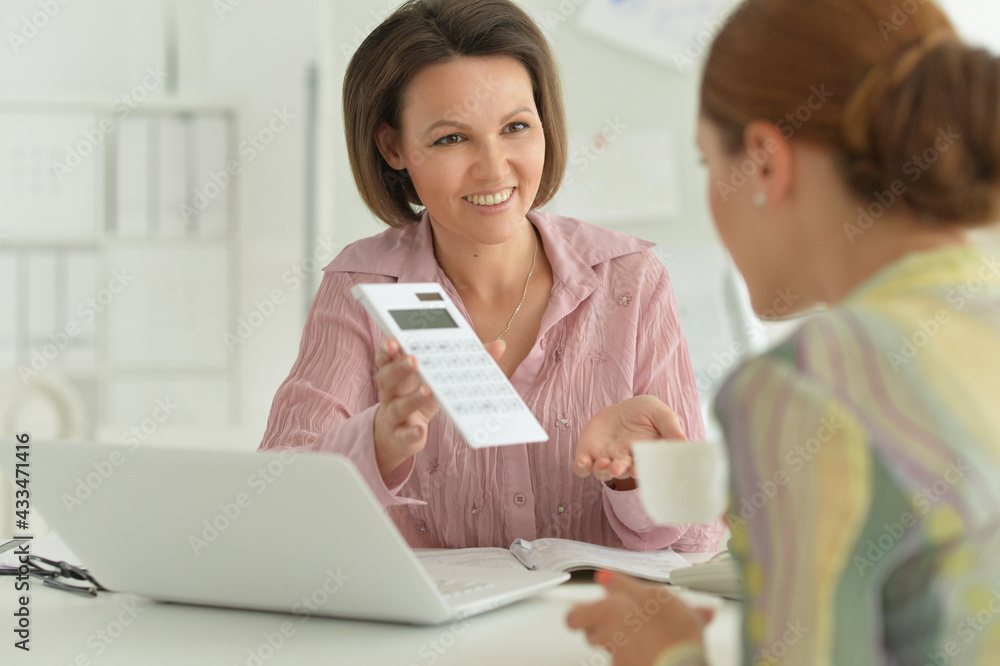 young businesswomen working in modern office young businesswomen working in modern office