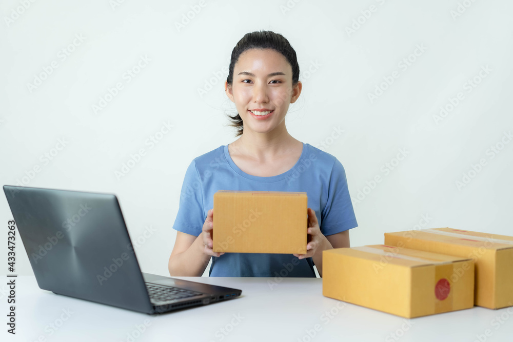 Asia woman Start up for Business Online. People with online shopping SME entrepreneur or freelance working concept. Banner size Asia woman Start up for Business Online. People with online shopping SME entrepreneur or freelance working concept. Banner size