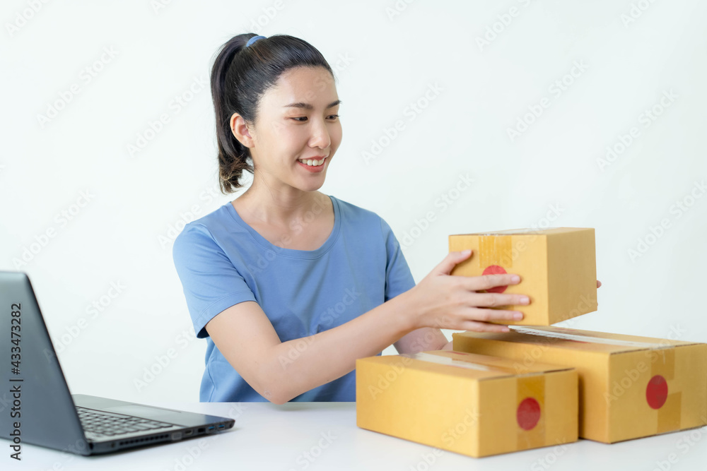 Asia woman Start up for Business Online. People with online shopping SME entrepreneur or freelance working concept. Banner size Asia woman Start up for Business Online. People with online shopping SME entrepreneur or freelance working concept. Banner size