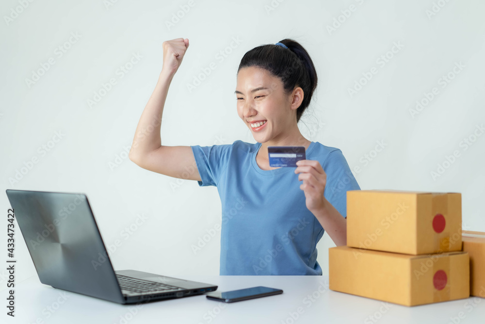 Asia woman Start up for Business Online. People with online shopping SME entrepreneur or freelance working concept. Banner size Asia woman Start up for Business Online. People with online shopping SME entrepreneur or freelance working concept. Banner size