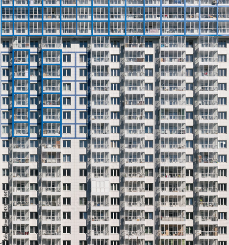 White facade of a multi-storey residential building