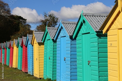 Colourful beach huts removed from the beach and placed in a carpark for the winter at Llanbedrog, Gwynedd, Wales, UK. photo