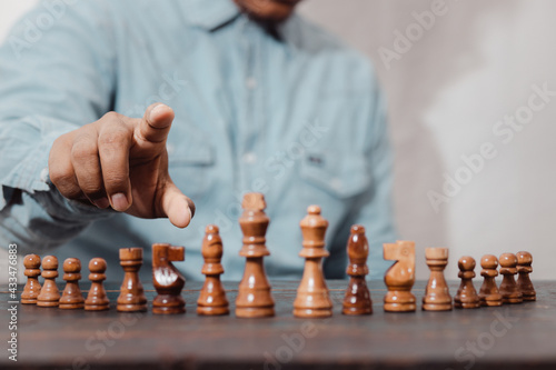 Business people move chess pieces on the concept of competitive strategy game for business success The concept of strategic planning and teamwork