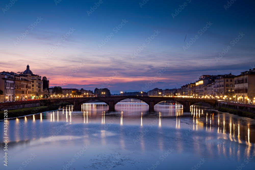Ponte Vecchio over Arno river in Florence, Italy at blue hour after sunset.