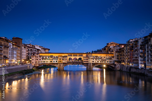 Ponte Vecchio over Arno river in Florence, Italy at blue hour after sunset. © belyaaa
