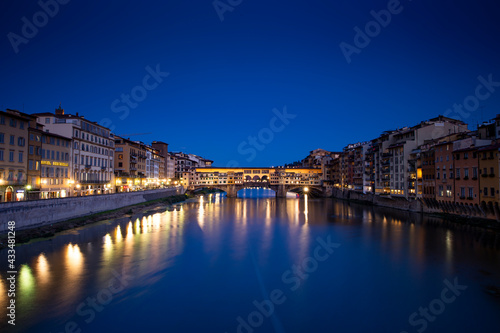 Ponte Vecchio over Arno river in Florence, Italy at blue hour after sunset.