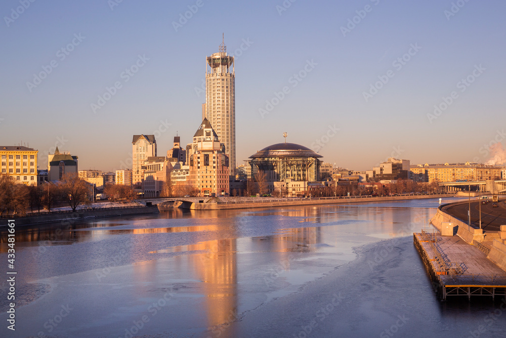 Fototapeta premium The building of the House of Music on the Moskva River in Moscow at dawn