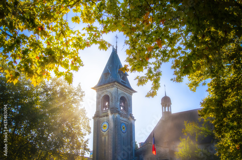 Sun's rays entering from behind the church bells
