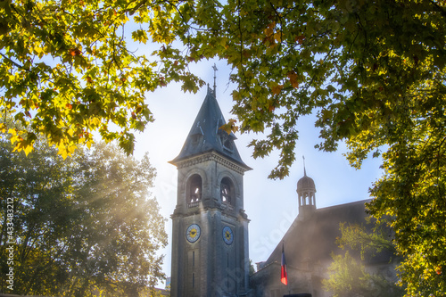 Sun's rays entering from behind the church bells