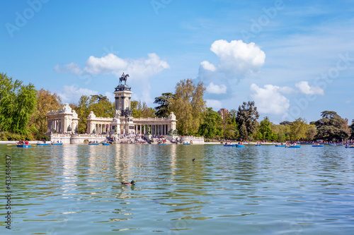 front view of lake in madrid with people riding in canoes