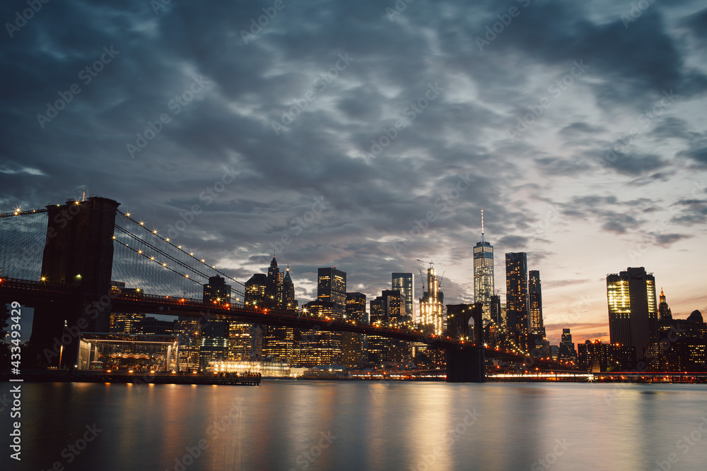 The New York City skyline from Dumbo at sunset low exposure
