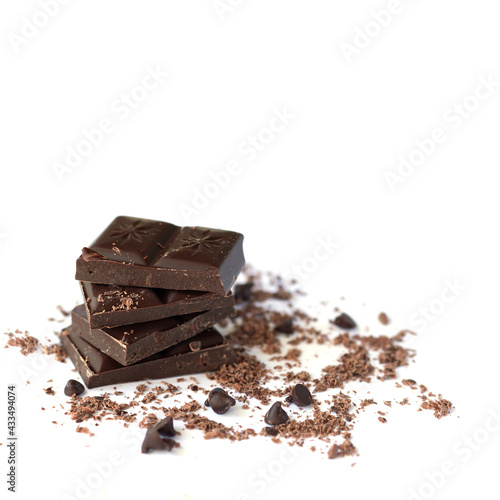 Dark chocolate stack with flakes powder isolated on white background