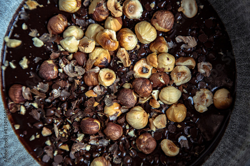 closeup of roasted hazelnuts in a chocolate dough