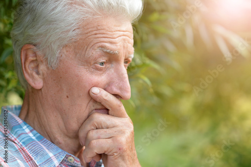 portrait of thinking senior man