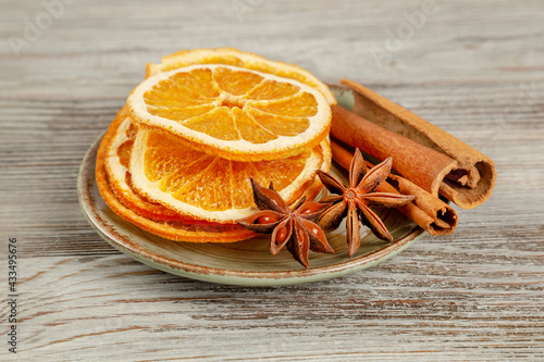 Spices and oranges in a plate