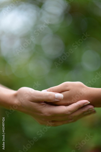 daughter and mother holding hands