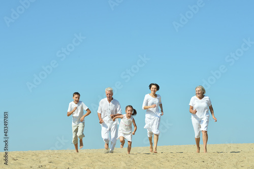 Happy family together on sand beach