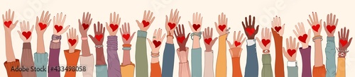 Large Group of diverse people with heart in hand. Arms and hands raised. Charity donation and volunteer work. Support and assistance. People diversity. Multicultural community. Teamwork
