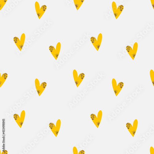Vector seamless bright pattern with yellow spotted hearts on a white background. Bright illustration for postcards, posters, pajamas, fabrics, holidays