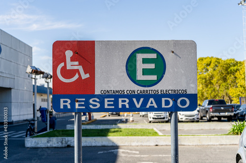Exclusive parking sign for people with reduced mobility or disabled where it says Reserved in Spanish. Inclusion concept.