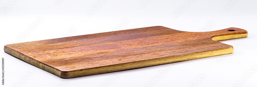 Kitchen utensils, vintage wooden chopping board, isolated white background