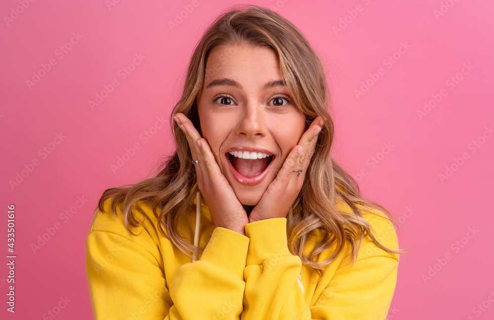 young pretty blonde woman cute face expression posing in yellow hoodie young pretty blonde woman cute face expression posing in yellow hoodie