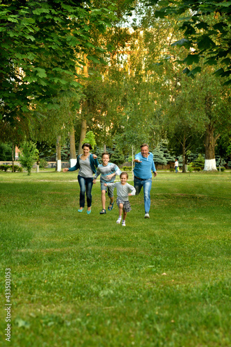 happy parents and children running