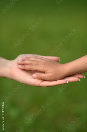 daughter and mother holding hands © aletia2011