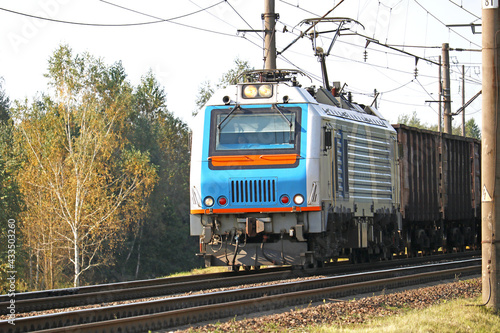 powerful electric locomotive with a freight train