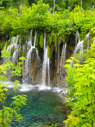 beautiful waterfall at a lagoon with clear lake