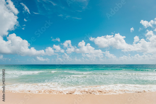 A bright sunny day at Macao Beach, Dominican Republic, Caribbean. Blue ocean and bright sky with clouds. Tropical beach