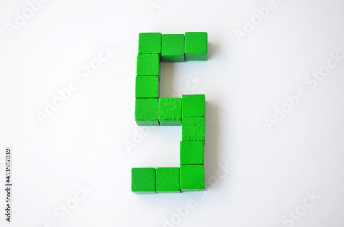 Number five from green cubes on a white background.