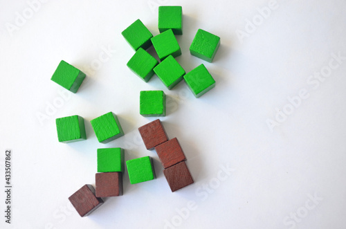 Green and brown cubes, squares on a white background.