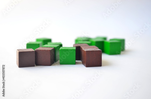 Green and brown cubes, squares on a white background.