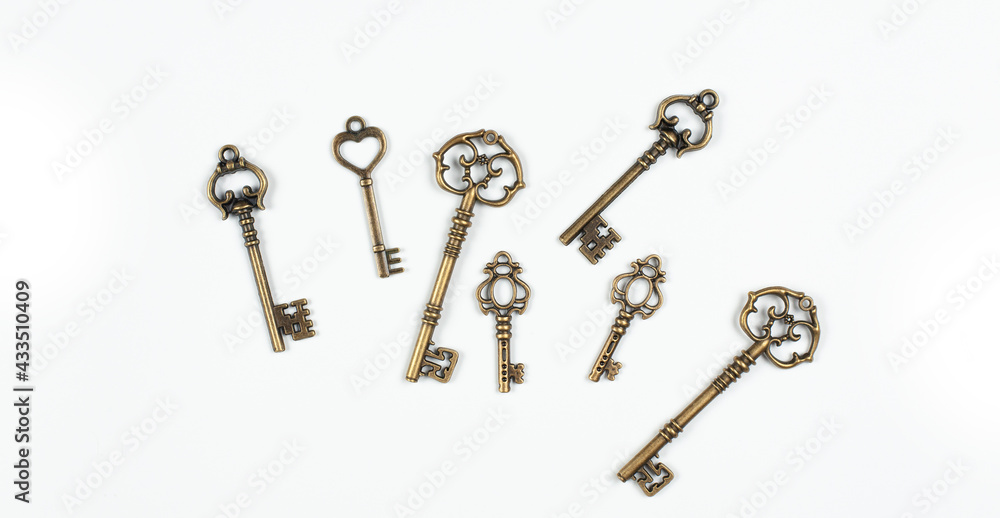 Old antique keys on a white background. Knowledge and wisdom. Old antique keys on a white background. Knowledge and wisdom.