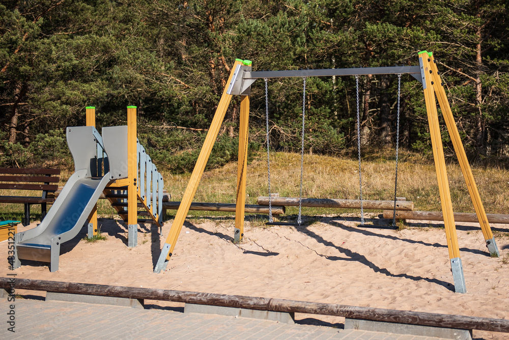 Fototapeta premium Playground with swings and slide.