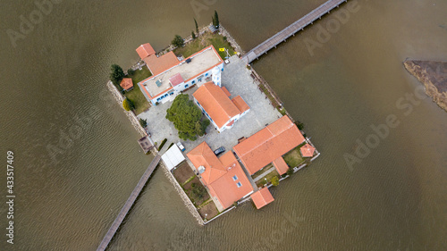 Aerial drone view od Agios Nikolaos Monastery on the Vistonida Lake at Porto Lagos, Greece photo