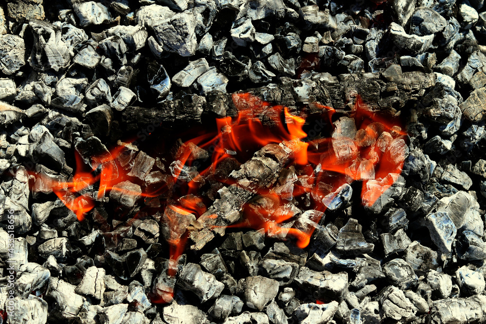 Barbecue Grill Pit With Glowing And Flaming Hot Charcoal Briquettes, Close-Up Barbecue Grill Pit With Glowing And Flaming Hot Charcoal Briquettes, Close-Up