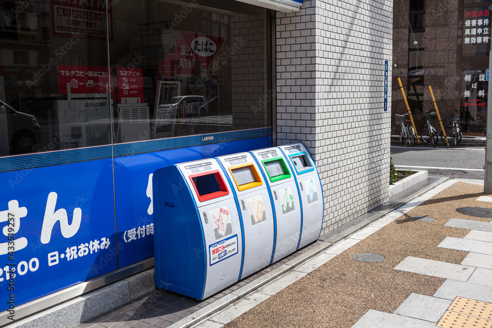 TOKYO, JAPANCIRCA APR, 2013 Four recycling bins are on street of city