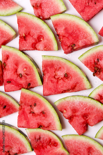 a lot of watermelon cut into pieces natural background