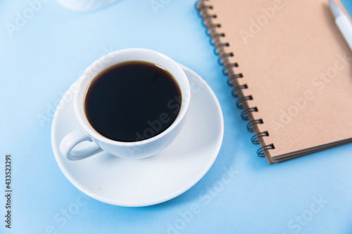 notepad with cup of coffee