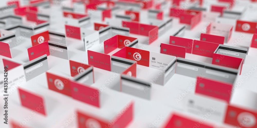 Flag of Tunisia on the mockup credit card maze. Financial problems related 3D rendering Flag of Tunisia on the mockup credit card maze. Financial problems related 3D rendering