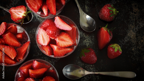 Strawberry desserts in cups. Summer snack strawberry yogurt granola.