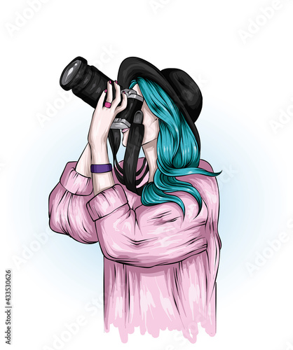 Beautiful girl in stylish clothes and with a vintage camera