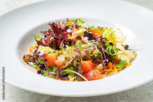 fresh salad with salmon and vegetables