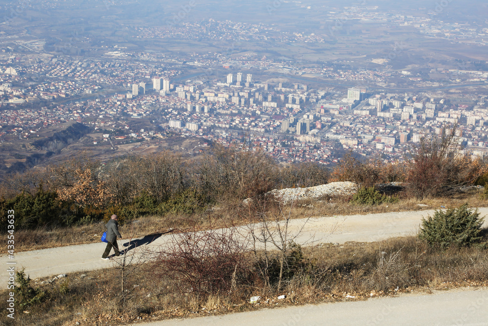 Woman walking at Vodno Hill in Skopje City, Macedonia. Vodno Hill highest point is 1066 meters altitude.