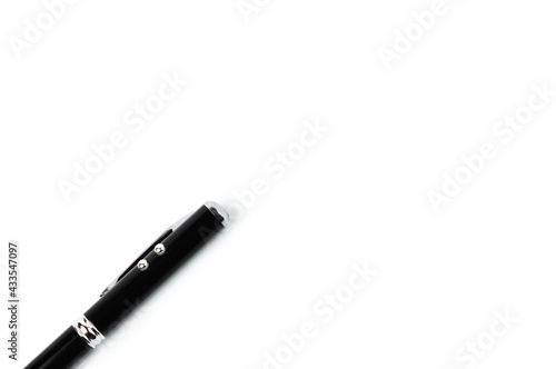 Top view of black pen over white background with copy space