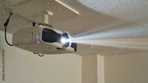 Bild auf Leinwand Streaks of light coming from the projector.